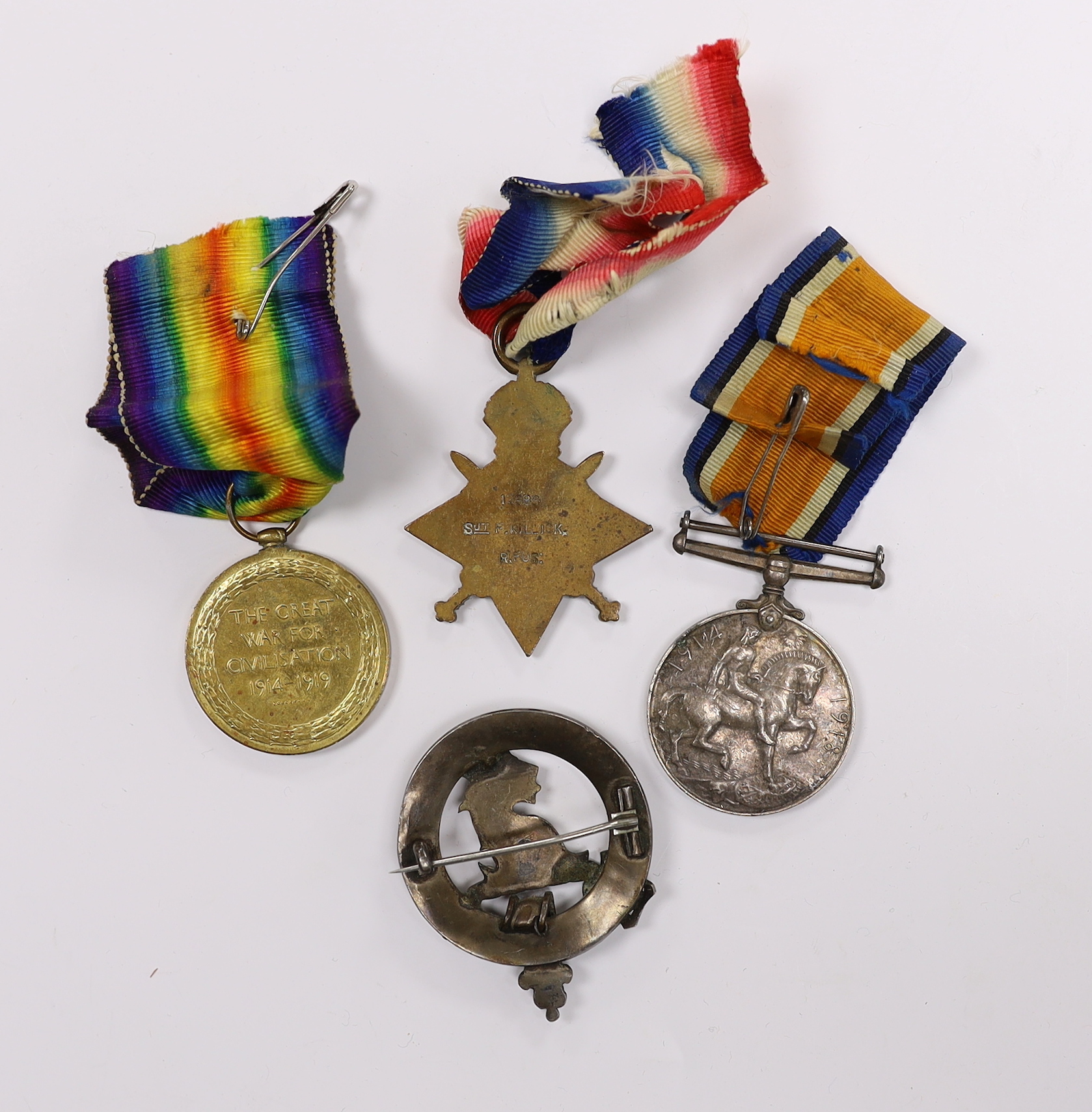 A WWI medal trio to SJT. F.W. Killick R. Fus. and a cap badge